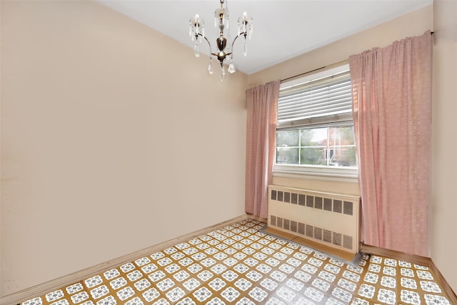 7345 53rd Rd, Maspeth, NY 11378 - empty room with radiator, a chandelier, light flooring, and baseboards