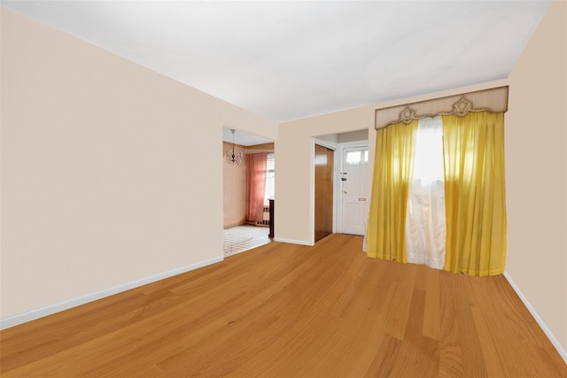 7345 53rd Rd, Maspeth, NY 11378 - empty room featuring light wood finished floors and baseboards