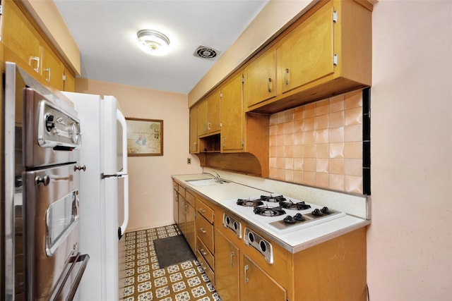 7345 53rd Rd, Maspeth, NY 11378 - kitchen with a sink, white appliances, light countertops, tasteful backsplash, and light floors