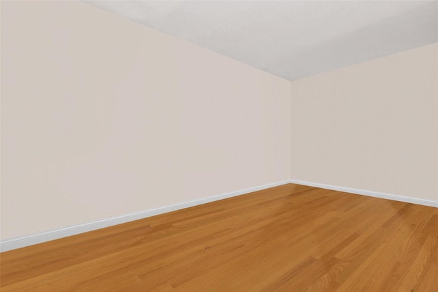 7345 53rd Rd, Maspeth, NY 11378 - unfurnished room featuring light wood-style floors and baseboards