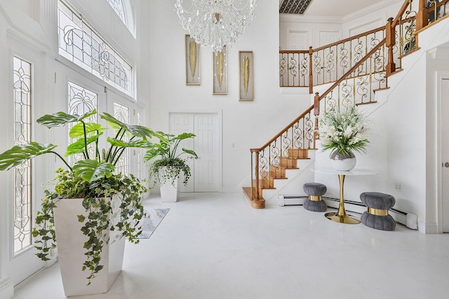 8 Stark Ct, New City, NY 10956 - entrance foyer with a high ceiling, stairs, plenty of natural light, a chandelier, and concrete floors