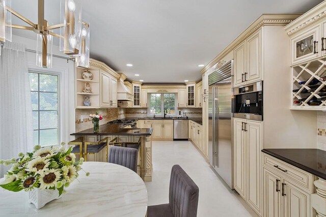 8 Stark Ct, New City, NY 10956 - kitchen featuring cream cabinets, appliances with stainless steel finishes, dark countertops, and recessed lighting