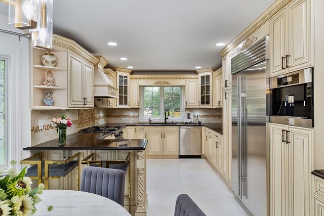 8 Stark Ct, New City, NY 10956 - kitchen with appliances with stainless steel finishes, cream cabinets, dark countertops, backsplash, and recessed lighting