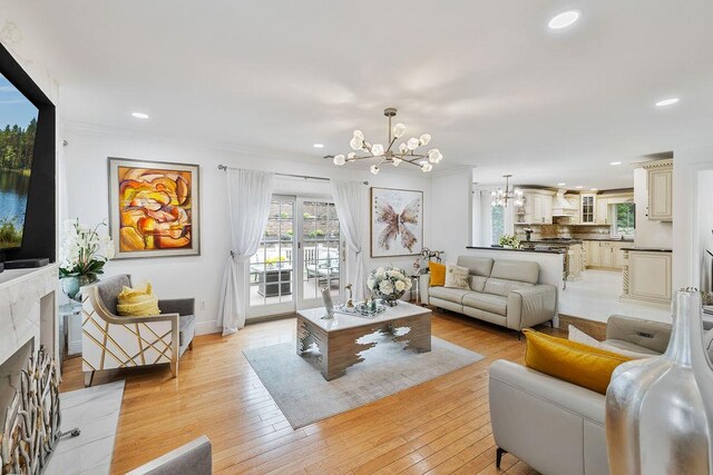 8 Stark Ct, New City, NY 10956 - living area with a chandelier, recessed lighting, light wood-style flooring, a premium fireplace, and baseboards