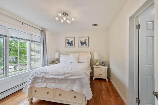 8 Stark Ct, New City, NY 10956 - bedroom featuring a baseboard radiator, wood finished floors, and baseboards
