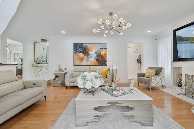 8 Stark Ct, New City, NY 10956 - living area with light wood-style flooring, a chandelier, recessed lighting, and crown molding