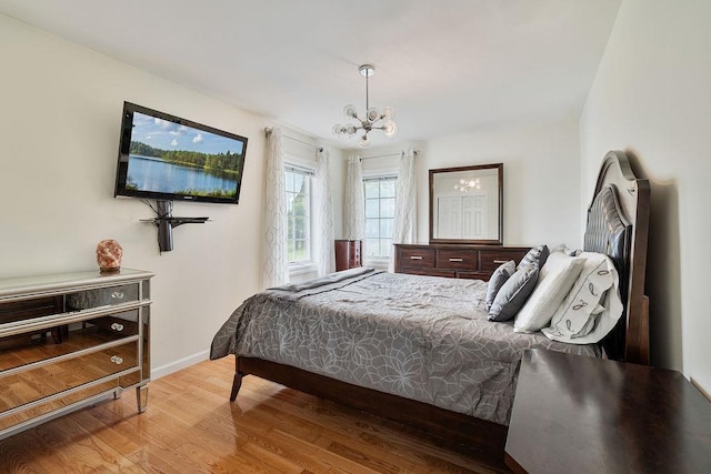 8 Stark Ct, New City, NY 10956 - bedroom with a chandelier, wood finished floors, and baseboards