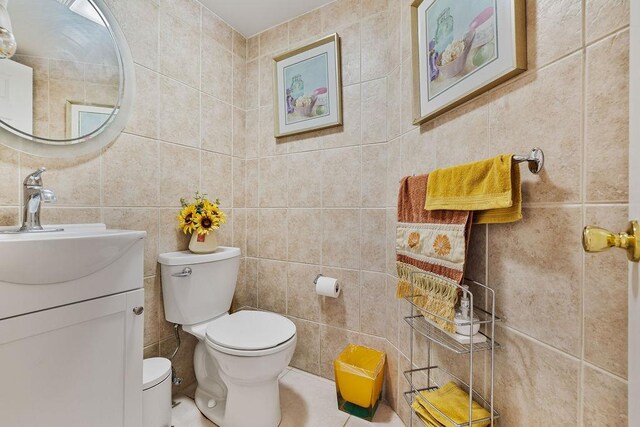 8 Stark Ct, New City, NY 10956 - bathroom with tile walls, toilet, and vanity