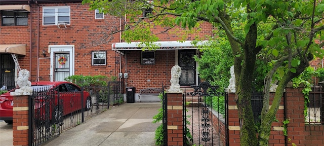 580 Schenck Ave, Brooklyn, NY 11207 - view of front facade with a gate and brick siding