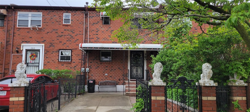 580 Schenck Ave, Brooklyn, NY 11207 - townhome / multi-family property with brick siding, a gate, and fence
