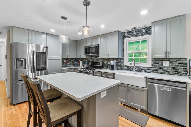 294 Rte 292, Holmes, NY 12531 - kitchen with appliances with stainless steel finishes, gray cabinetry, a sink, light wood finished floors, and recessed lighting