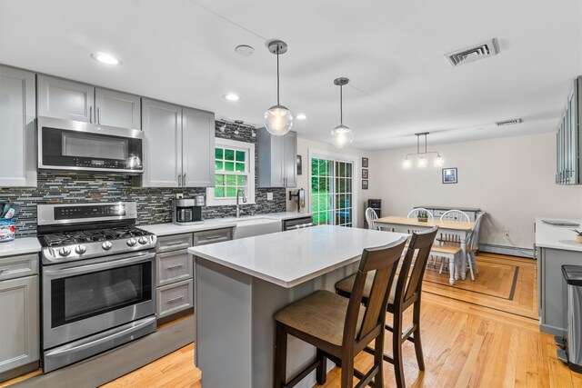 294 Rte 292, Holmes, NY 12531 - kitchen featuring appliances with stainless steel finishes, gray cabinetry, tasteful backsplash, light countertops, and recessed lighting
