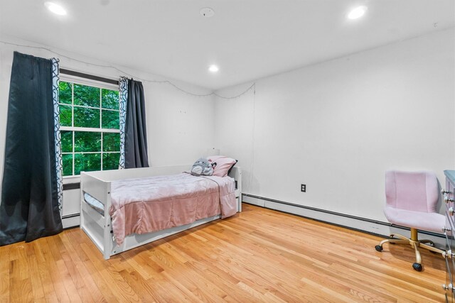 294 Rte 292, Holmes, NY 12531 - bedroom with wood finished floors, a baseboard radiator, and recessed lighting