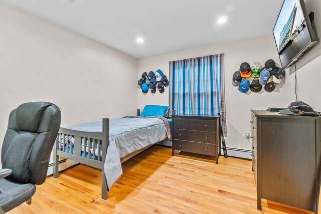 294 Rte 292, Holmes, NY 12531 - bedroom with wood finished floors, recessed lighting, and a baseboard radiator