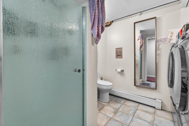 294 Rte 292, Holmes, NY 12531 - full bath featuring a baseboard radiator, toilet, tile patterned flooring, and washer and clothes dryer