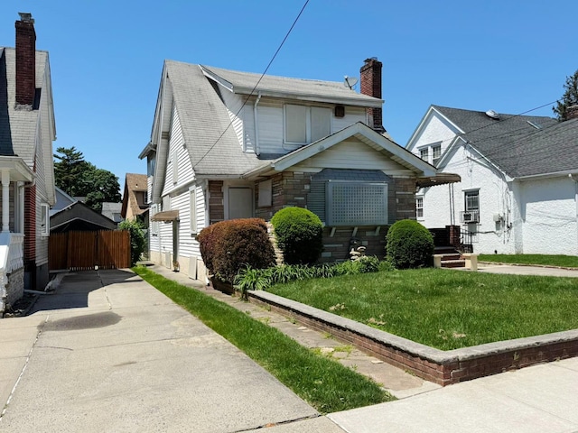 186-39 Ilion Ave, Saint Albans, NY 11412 - bungalow-style home with concrete driveway and a chimney