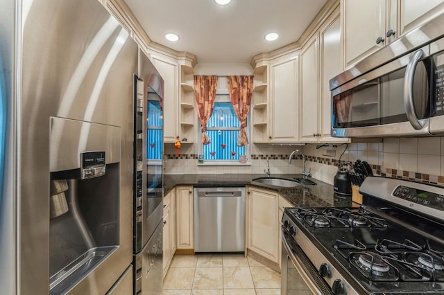 1355 Broadway Unit B20, Hewlett, NY 11557 - kitchen featuring appliances with stainless steel finishes, cream cabinets, a sink, open shelves, and tasteful backsplash