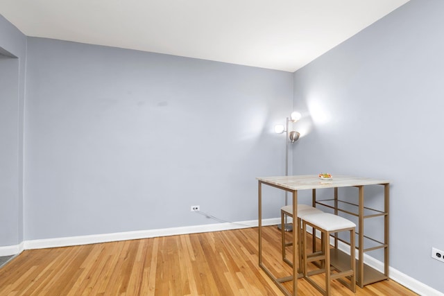 84-19 51st Ave Unit 2E, Elmhurst, NY 11373 - unfurnished office featuring baseboards and wood finished floors