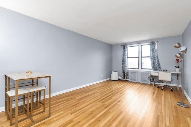 84-19 51st Ave Unit 2E, Elmhurst, NY 11373 - unfurnished room with light wood-style flooring, an office area, and baseboards