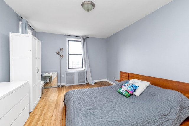 84-19 51st Ave Unit 2E, Elmhurst, NY 11373 - bedroom with light wood finished floors and baseboards