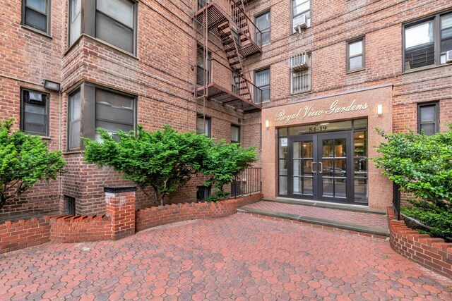 84-19 51st Ave Unit 2E, Elmhurst, NY 11373 - doorway to property with french doors and brick siding