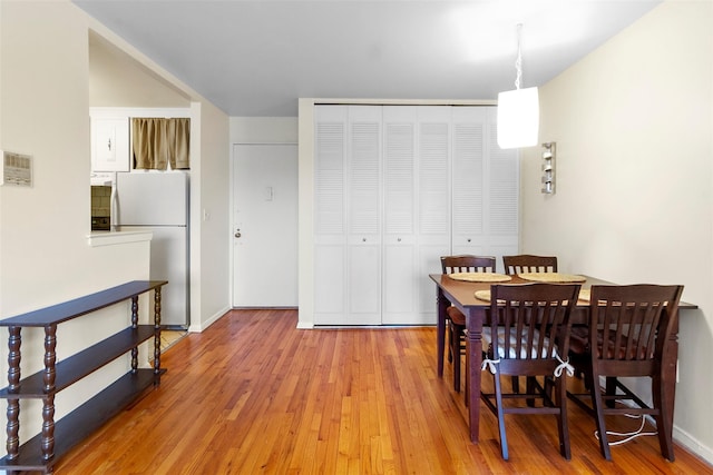 395 Westchester Ave Unit 3A, Port Chester, NY 10573 - dining area with light wood finished floors and baseboards