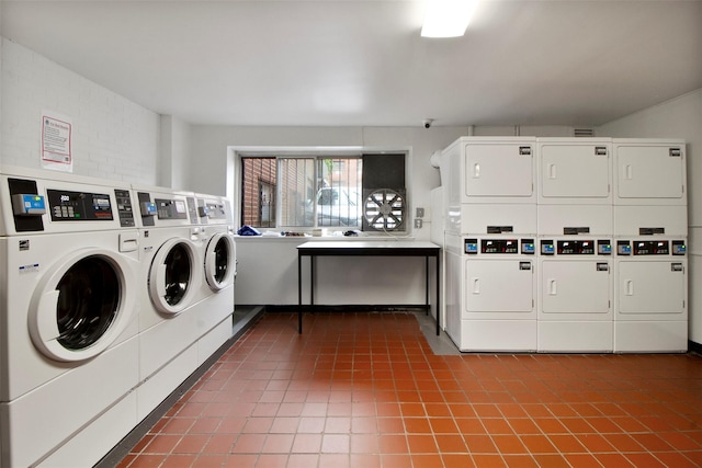 395 Westchester Ave Unit 3A, Port Chester, NY 10573 - shared laundry room featuring stacked washing machine and dryer, dark tile patterned floors, and separate washer and dryer
