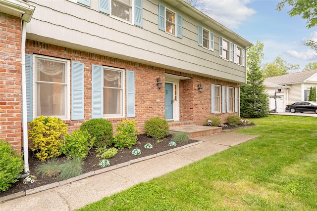 123 Birch Ln, New City, NY 10956 - doorway to property featuring a lawn and brick siding