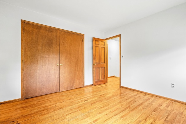 123 Birch Ln, New City, NY 10956 - unfurnished bedroom featuring light wood-style floors, a closet, and baseboards