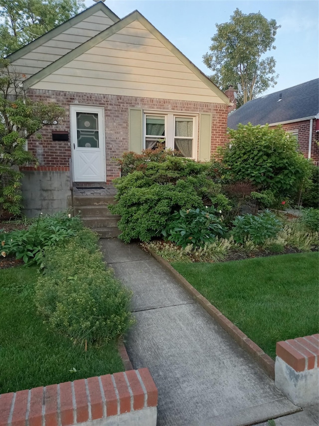 83-17 247th St, Bellerose, NY 11426 - view of front facade featuring brick siding and entry steps
