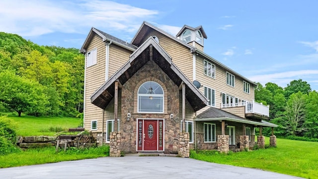 42 Blackstone Rdg, Holmes, NY 12531 - view of front of home featuring stone siding, a front lawn, and covered porch