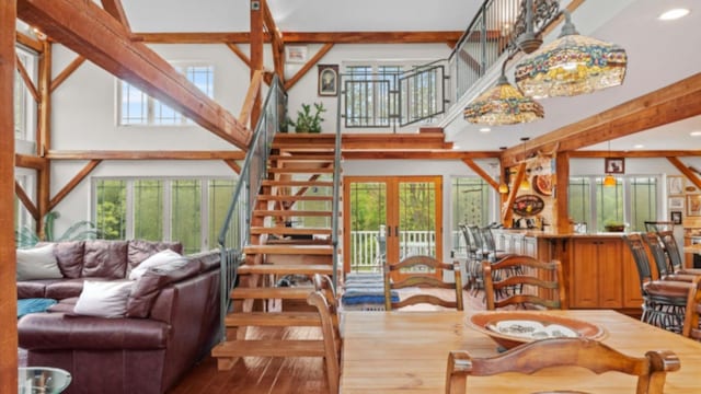 42 Blackstone Rdg, Holmes, NY 12531 - living area with healthy amount of natural light, stairs, hardwood / wood-style floors, recessed lighting, and french doors