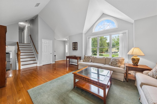 7 Brandy Ln, Hopewell Junction, NY 12590 - living room with wood-type flooring, vaulted ceiling, and stairs
