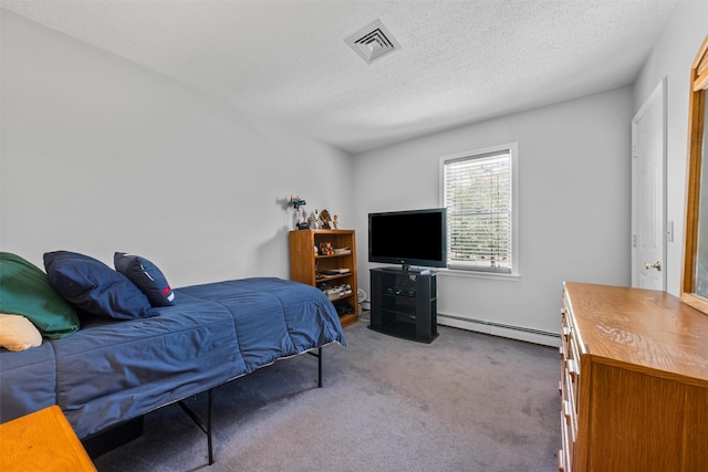 7 Brandy Ln, Hopewell Junction, NY 12590 - bedroom featuring baseboard heating, carpet, and a textured ceiling