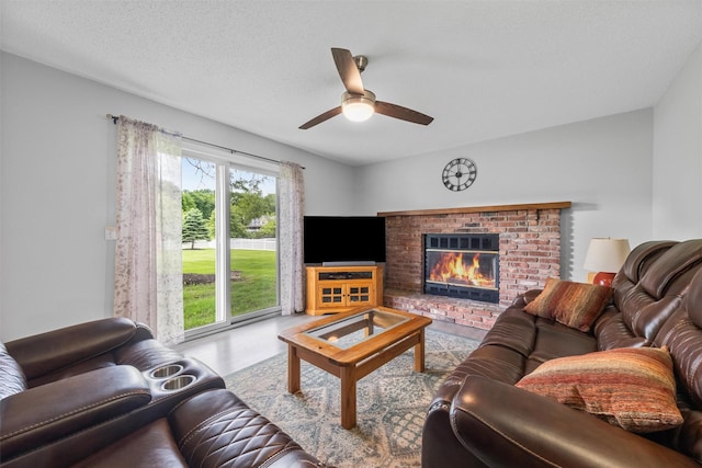 7 Brandy Ln, Hopewell Junction, NY 12590 - living area with a ceiling fan and a fireplace