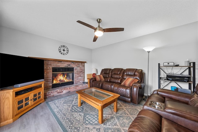 7 Brandy Ln, Hopewell Junction, NY 12590 - living area featuring a ceiling fan, a fireplace, and wood finished floors