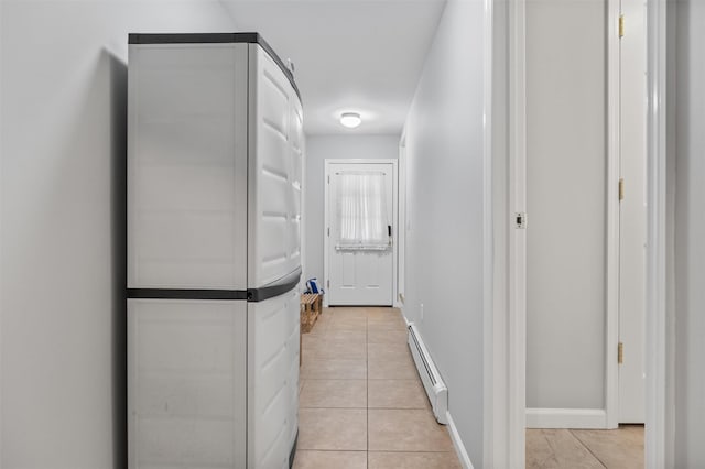7 Brandy Ln, Hopewell Junction, NY 12590 - hall with a baseboard radiator, light tile patterned floors, and baseboards