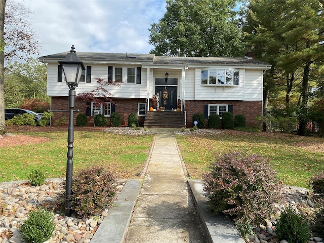 1 Parkview Dr, Middletown, NY 10940 - split foyer home featuring brick siding, a front lawn, and a chimney