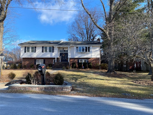 1 Parkview Dr, Middletown, NY 10940 - raised ranch with brick siding, a front yard, and a chimney