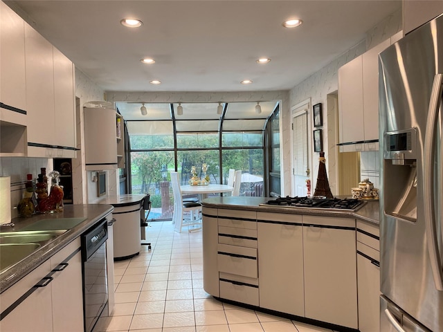 1 Parkview Dr, Middletown, NY 10940 - kitchen with stainless steel appliances, dark countertops, recessed lighting, light tile patterned flooring, and a sunroom