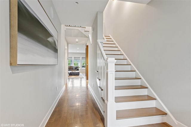 18 Rose Ln, Rye Brook, NY 10573 - stairs with wood finished floors, baseboards, and recessed lighting