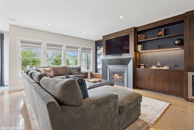 18 Rose Ln, Rye Brook, NY 10573 - living room featuring a glass covered fireplace, light wood-style flooring, and recessed lighting