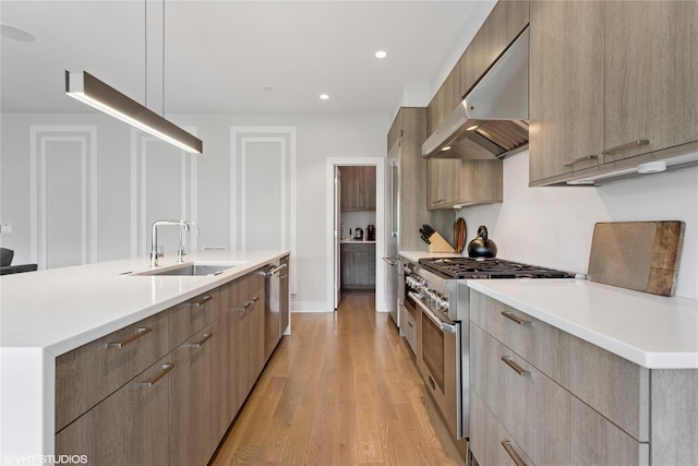 18 Rose Ln, Rye Brook, NY 10573 - kitchen with appliances with stainless steel finishes, modern cabinets, extractor fan, and recessed lighting