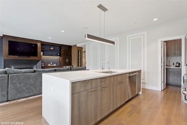 18 Rose Ln, Rye Brook, NY 10573 - kitchen with a sink, modern cabinets, stainless steel dishwasher, and light wood-type flooring
