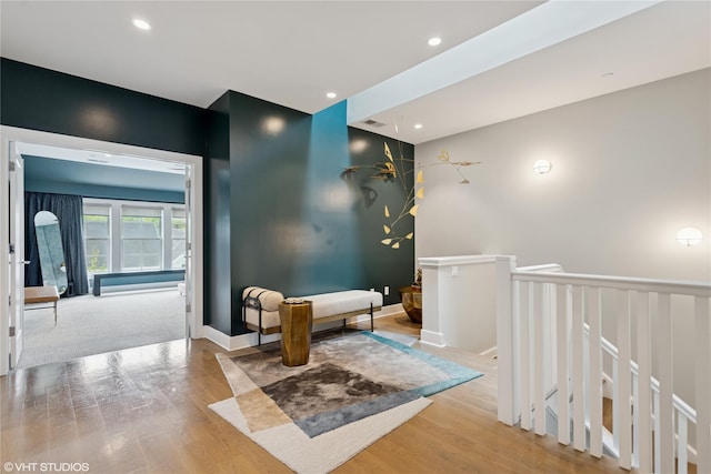 18 Rose Ln, Rye Brook, NY 10573 - hall with wood finished floors, an upstairs landing, recessed lighting, and baseboards