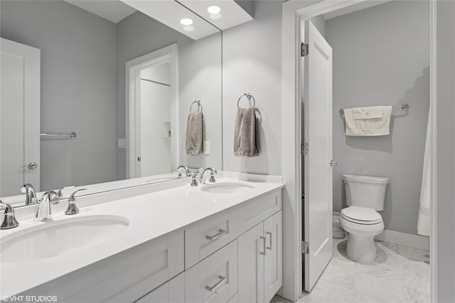 18 Rose Ln, Rye Brook, NY 10573 - full bath with double vanity, marble finish flooring, toilet, baseboards, and recessed lighting
