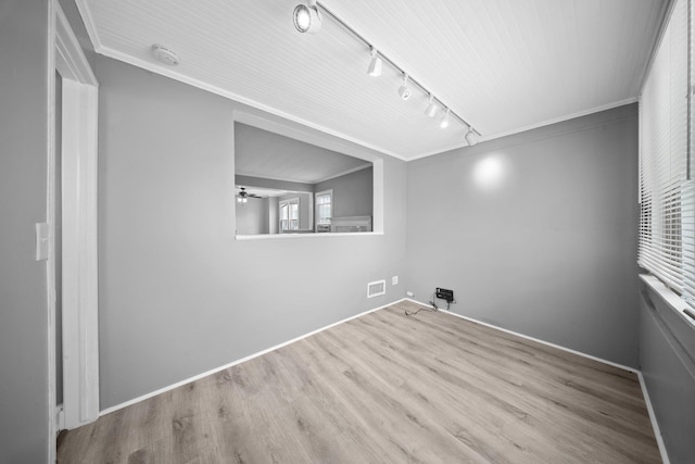 199 Central Ave, Bethpage, NY 11714 - spare room with rail lighting, crown molding, wood finished floors, a ceiling fan, and baseboards