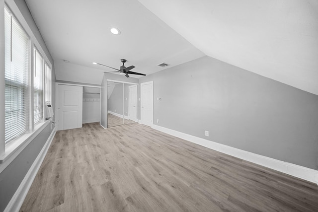 199 Central Ave, Bethpage, NY 11714 - unfurnished bedroom with vaulted ceiling, light wood-style flooring, recessed lighting, ceiling fan, and baseboards