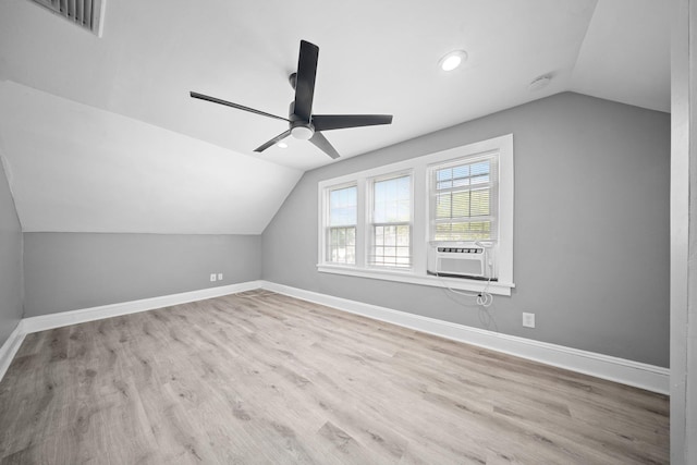 199 Central Ave, Bethpage, NY 11714 - additional living space featuring vaulted ceiling, ceiling fan, cooling unit, wood finished floors, and baseboards