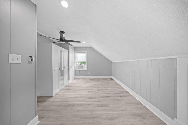 199 Central Ave, Bethpage, NY 11714 - bonus room featuring a textured ceiling, ceiling fan, vaulted ceiling, wood finished floors, and cooling unit